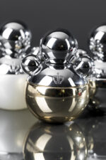 IRFE PATCHOULI perfume bottle in front of other