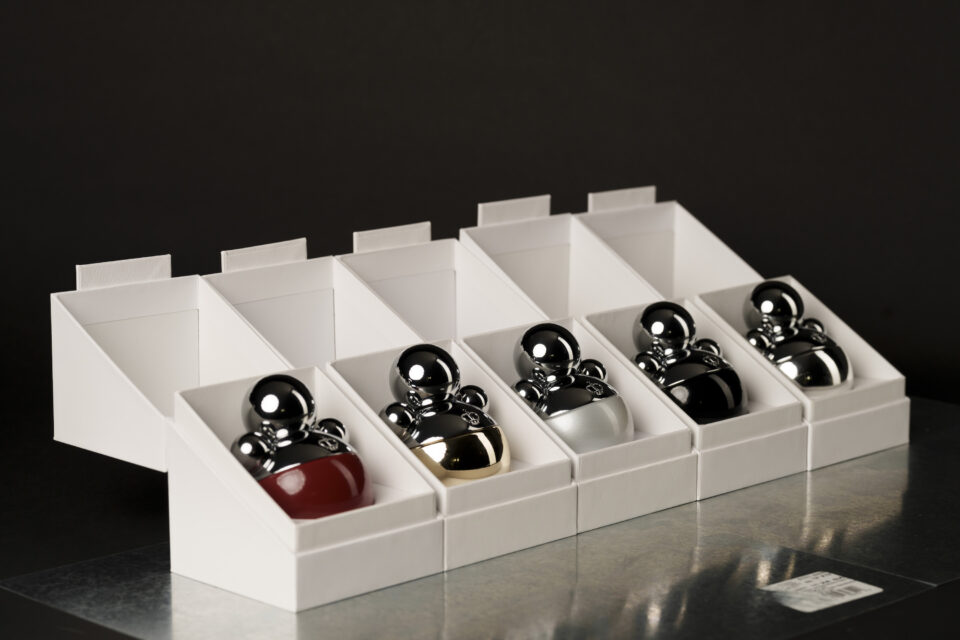 Collection of IRFE parfumes in a row of open white boxes