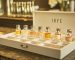 IRFE limited edition mini perfume samplers set in a high quality open white box on a vanity