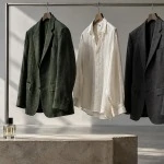 Green and charcoal jackets and an ivory shirt