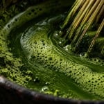 Fine green matcha foam and powder in a dark