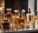 A collection of luxury perfume bottles displayed on a vanity