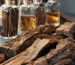 oud wood pieces and vials with essence in a professional perfumery laboratory